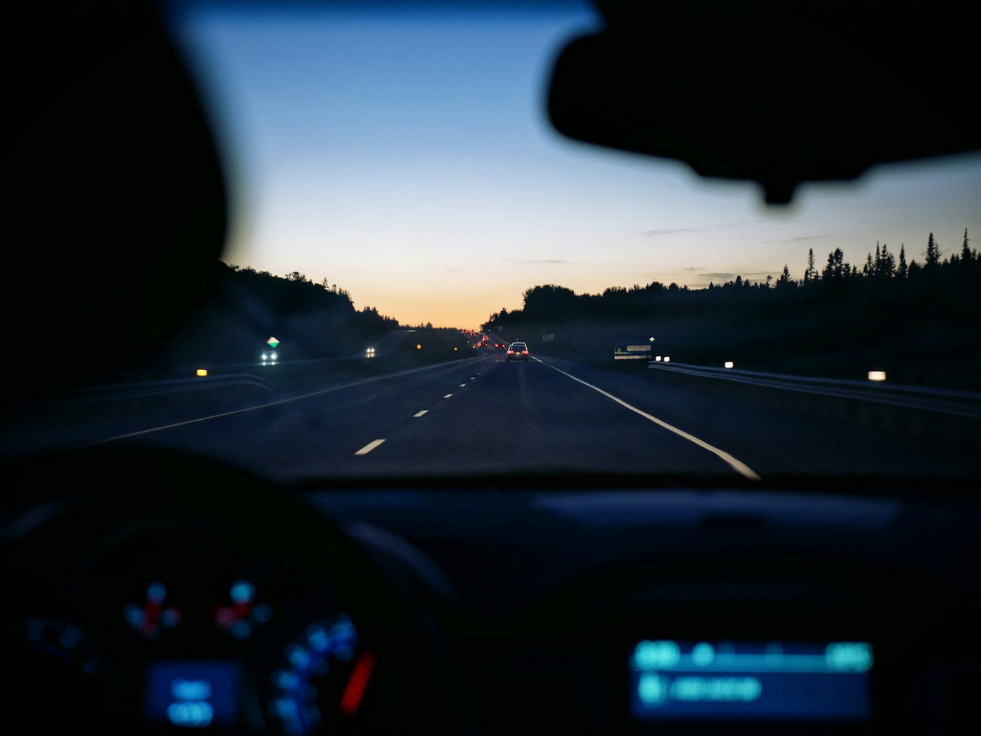 Driver viewing the road from a car dashboard with minimal visual distraction