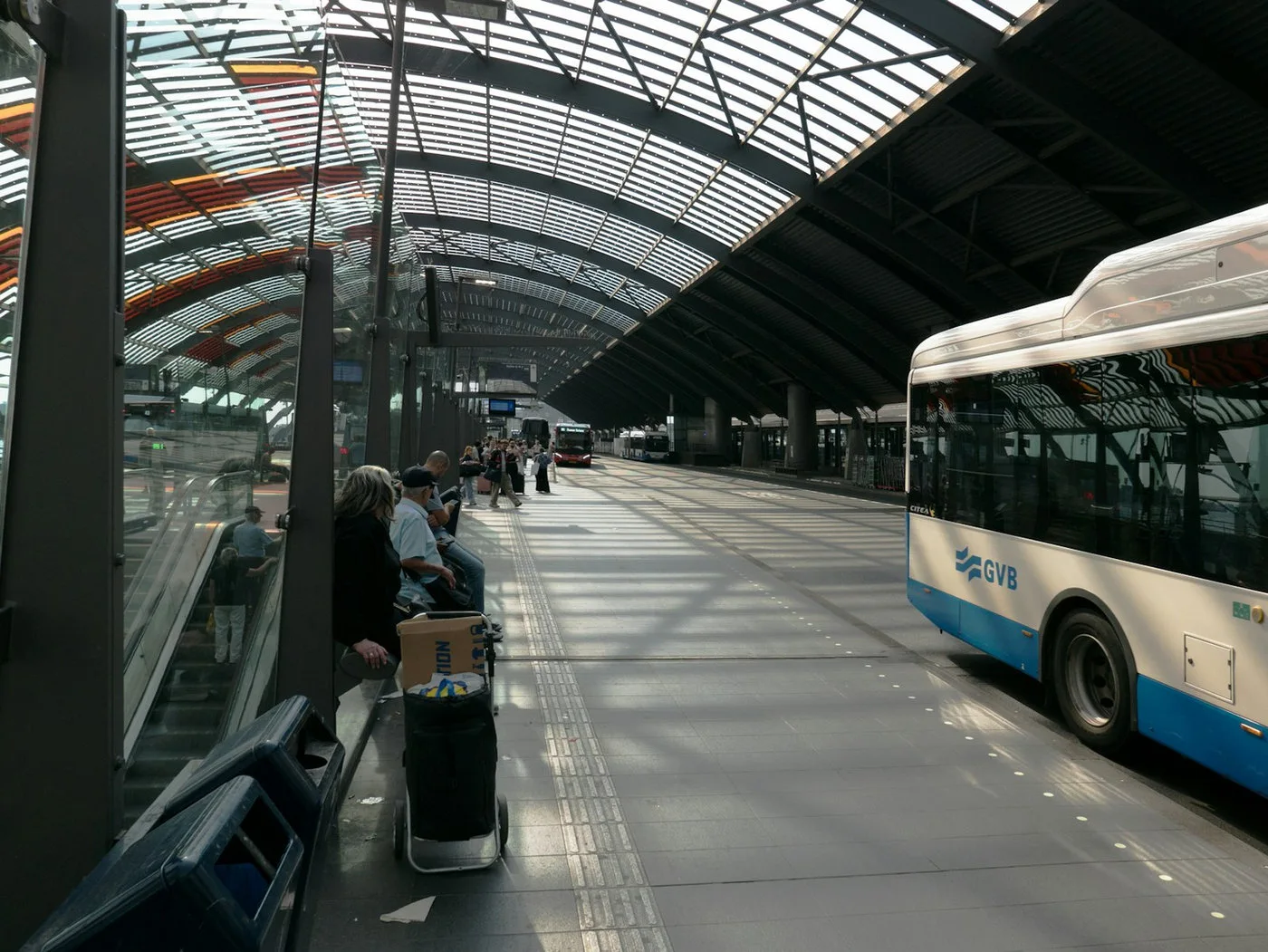 Interior of a public bus with passengers and information displays