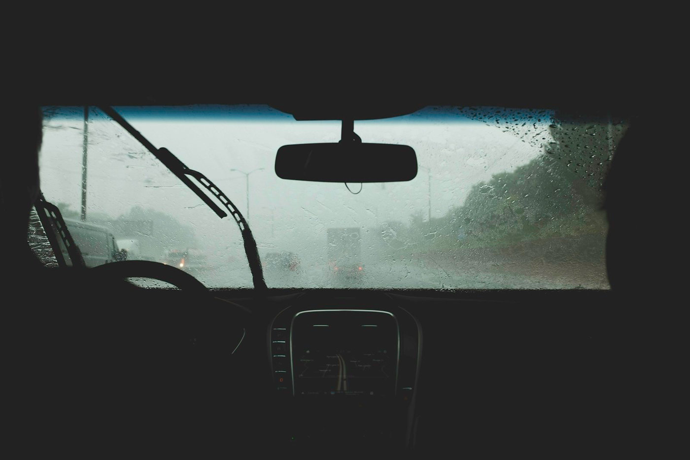 Vehicle driving through heavy rain, representing difficult autonomous vehicle simulation scenarios